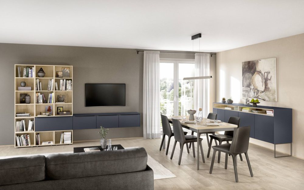 SIKO Modulární nábytek v modré barvě s matným povrchem do obýváku i kuchyně a jídelny spojí obývák s kuchyní.