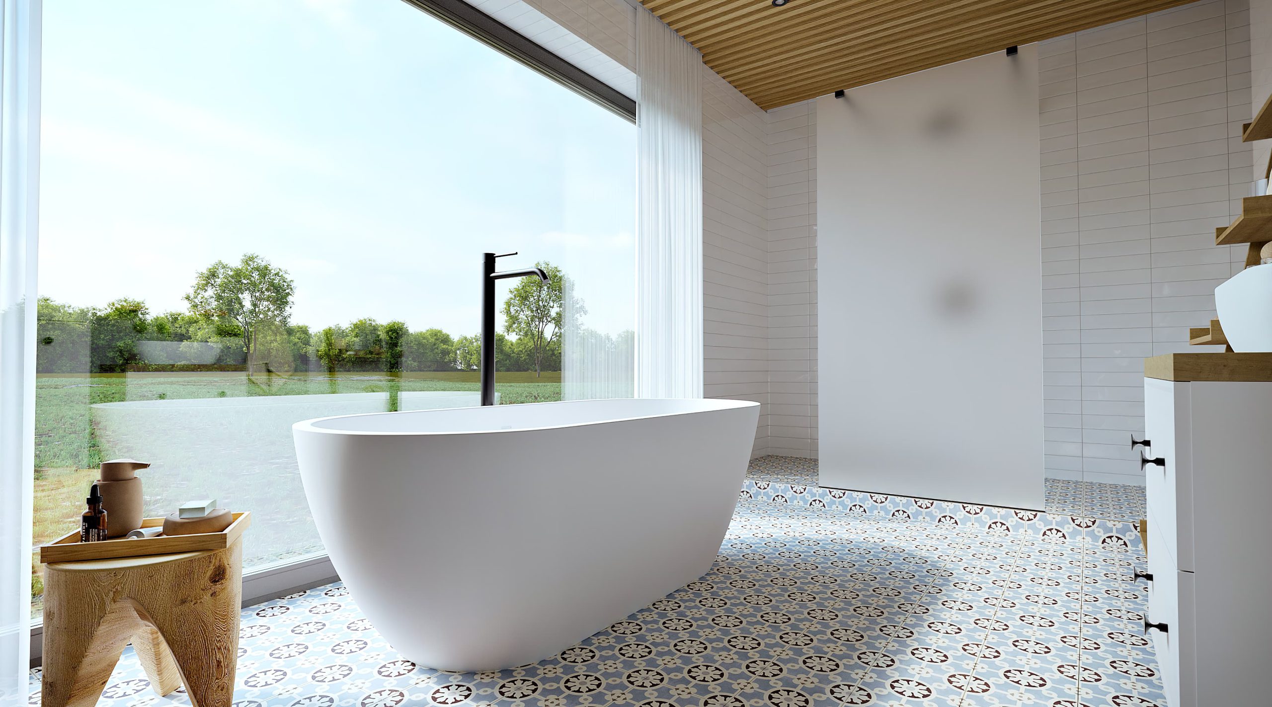 SIKO Volně stojící vana ve skandinávsky laděné velké koupelně se sprchovým koutem, vzorovaná dlažba, masivní stolička, bílý koupelnový nábytek