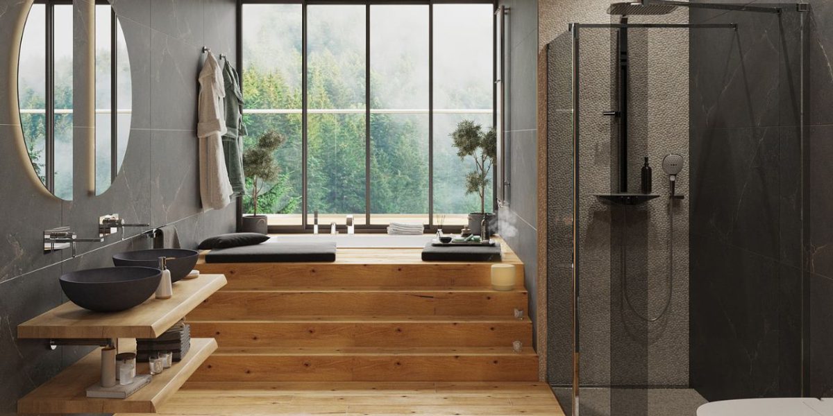 SIKO_COVER_Stylové řešení wellness koupelna, prostorný sprchový kout s kouřovými skly, zapuštěná vana, velké okno, kulaté zrcadlo, dřevěná dlažba, šedý obklad