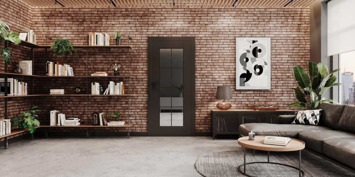 SIKO_cover_Moderné krídlové tmavo hnedé dvere so zrkadlovým sklom v industriálnej obývačke, odhalené tehly na stene, vysoké okno. Obľúbený loft